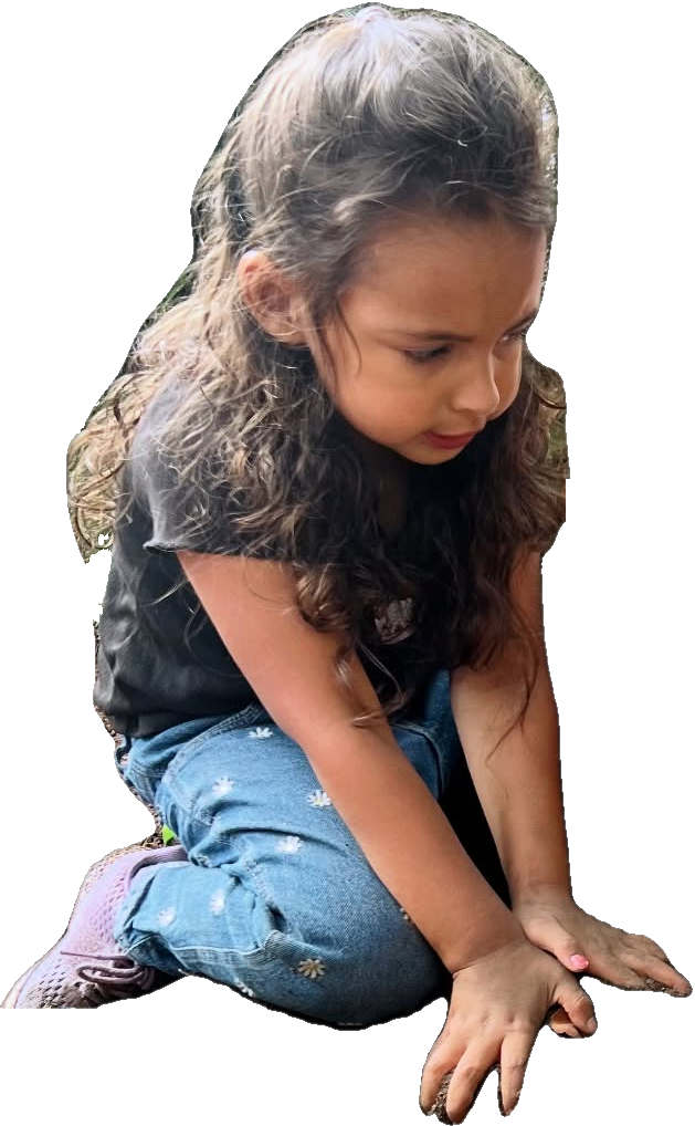Child playing and exploring outdoors at Rita's Kids Daycare